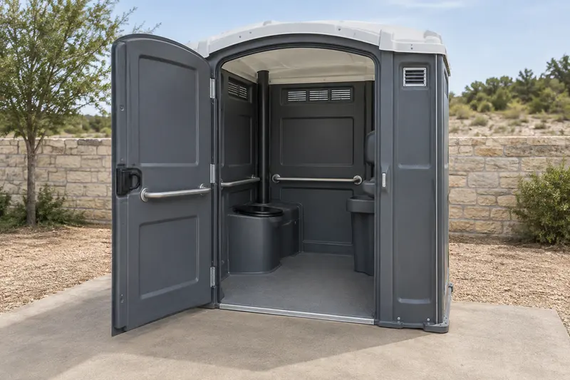 Wide-entry portable restroom showing its doorway and interior grab rails